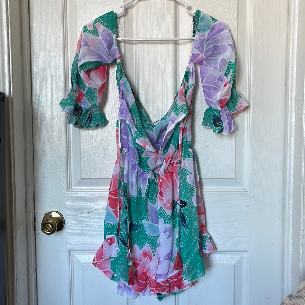Super cute beach cover up/romper.